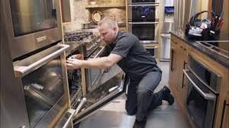 electrician installing dishwasher